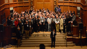A huge crowd of Spizzwink alums onstage at Battell Chapel performing No Regrets during the Centennial Reunion.